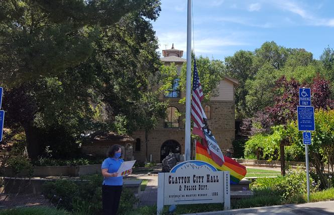 As the rainbow flag is raised at City Hall in Clayton for the first time Monday, June 1, Mayor Julie Pierce reads a proclamation declaring Pride Month. Photo: Cynthia Laird