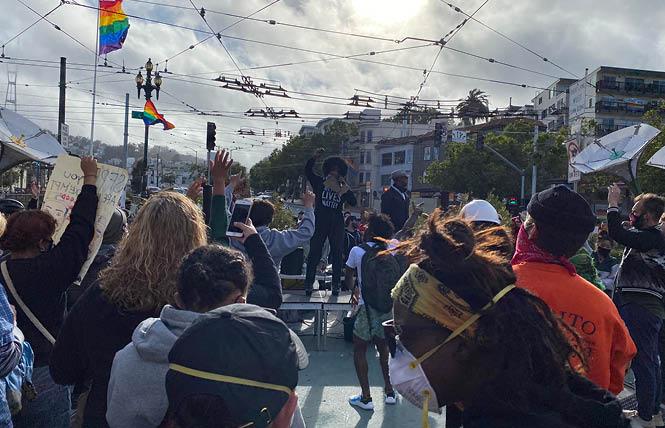 Drag performer Afrika America emceed Ready to Listen, an event in the Castro Friday, June 5, to address anti-black racism in the LGBT community. A rally in Jane Warner Plaza occurred at the conclusion of a march from San Francisco City Hall early Friday evening. Photo: John Ferrannini