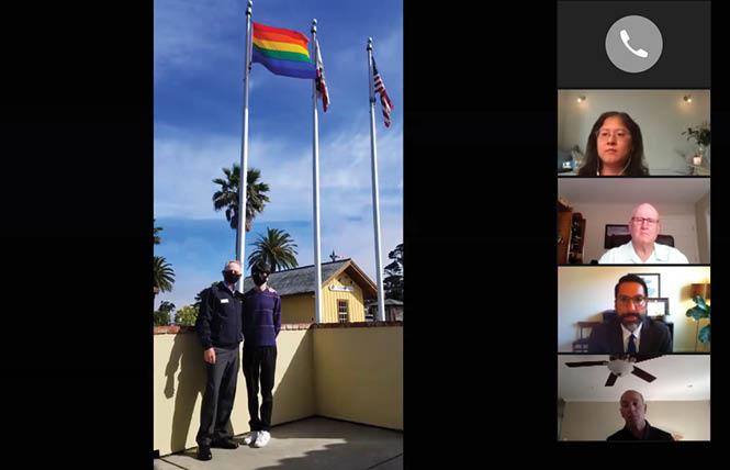 Colma Mayor John Goodwin, left, and his son, Sean, raised the rainbow flag this week at the Colma Community Center. Photo: Courtesy Town of Colma