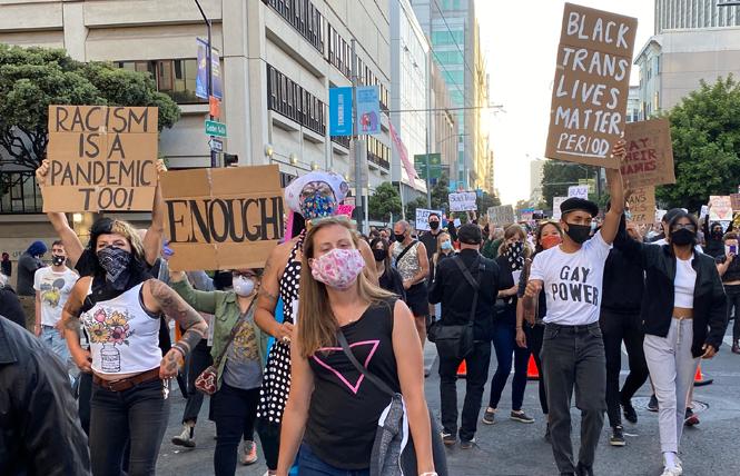 Protesters, many of whom wore masks, took part in a march for trans rights June 18. Photo: Liz Highleyman