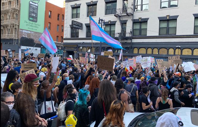 A crowd arrives in the Tenderloin June 18 during a march for Black trans lives. At least two protest marches are scheduled for June 28, when the in-person San Francisco Pride parade would have taken place. Photo: John Ferrannini