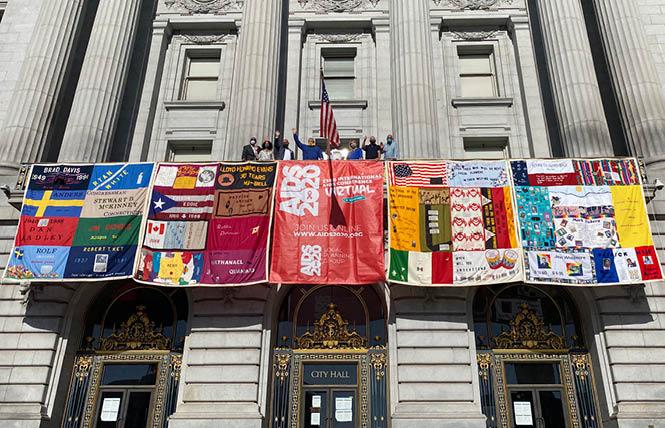 Panels of the AIDS Memorial Quilt were unfurled from San Francisco City Hall Monday, July 6, at the start of the now-virtual International AIDS Conference. Photo: Liz Highleyman