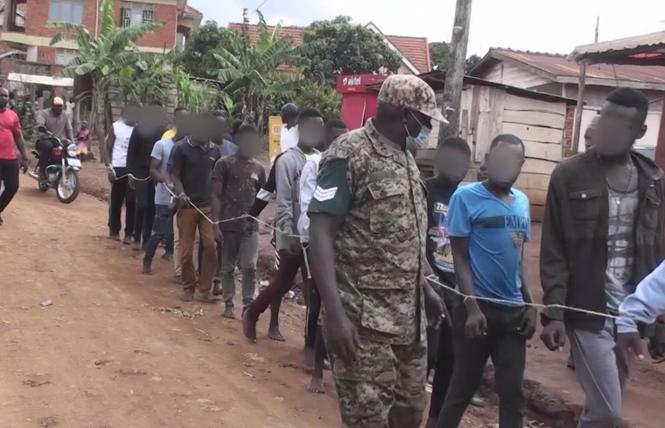 Ugandan Police and local officials bound the hands of young shelter residents and tied them together in a human chain in March. Photo: Courtesy Sky News