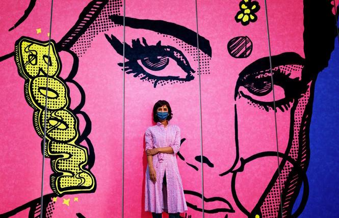 Artist Jas Charanjiva and her mural, 'Don't Mess With Me' at the Asian Art Museum