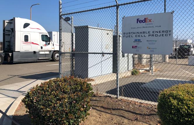 A cargo truck waits on Sally Ride Way to enter the secure FedEx facility at Oakland International Airport. Photo: Matthew S. Bajko