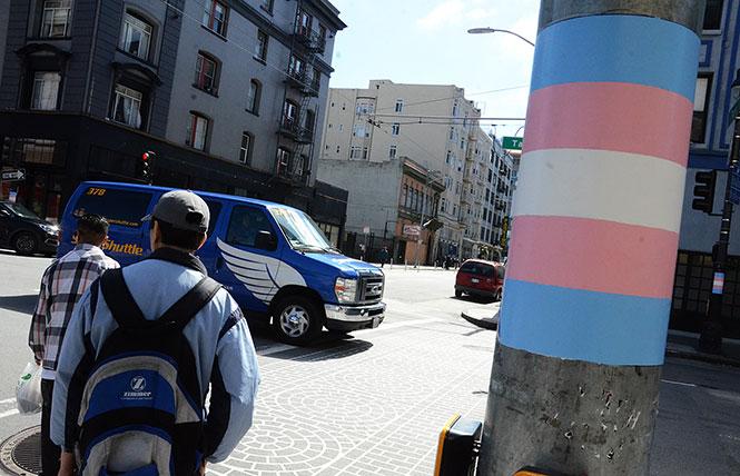 San Francisco is accepting proposals for $1.6 million in grants to the trans community. Above, trans flag colors are painted on light poles in the Transgender District. Photo: Rick Gerharter