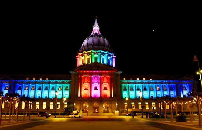 San Francisco City Hall was lit in rainbow colors last year to honor the life of lesbian pioneer Phyllis Lyon, who died April 9. Photo: Steven Underhill