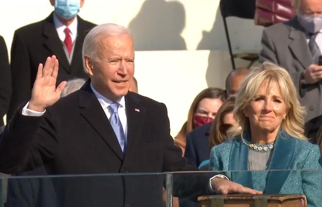 Joe Biden takes the oath of office January 20 while his wife, Jill, holds the Bible. Photo: Screengrab