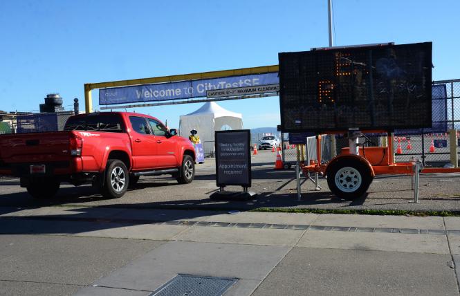 A vehicle enters the drive-in entrance to San Francisco's COVID testing site at Pier 30. Photo: Rick Gerharter