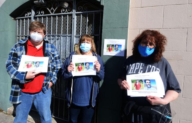 Three siblings of Christopher Woitel, brother Frank Woitel, left, and sisters Lara Haven and Kathy Flynn, held fliers outside Woitel's San Francisco apartment February 12, asking for help in finding their brother, who has been missing since January 9. Photo: Rick Gerharter