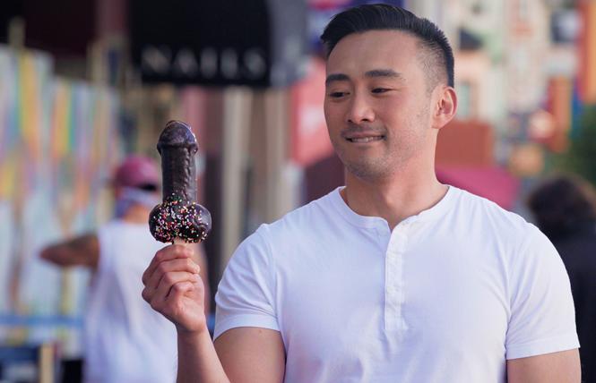 Filmmaker Alex Liu holds a penis-shaped lollipop. Photo: Courtesy Herra Productions