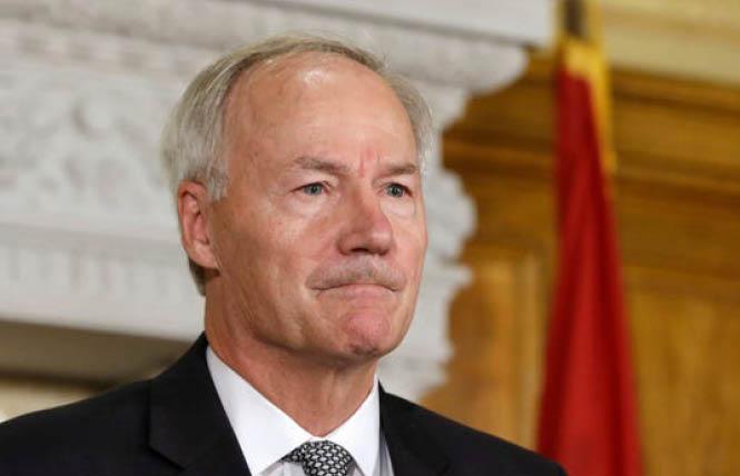 Arkansas Governor Asa Hutchinson signed an anti-trans bill into law March 25, which will lead to the state being added to California's "no-fly" list for publicly-funded travel. Photo: AP