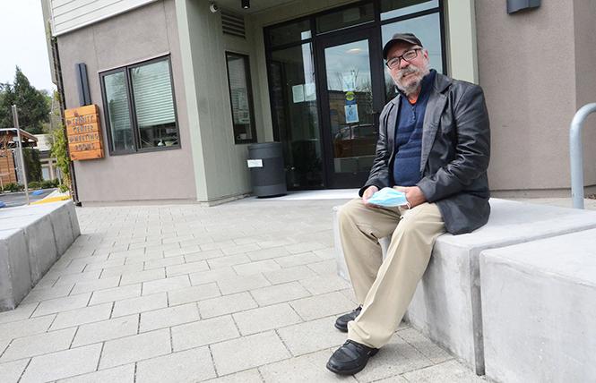 Charlie Uher sits in front of his apartment building in Walnut Creek. Photo: Rick Gerharter
