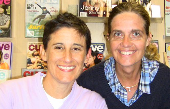 Frances "Franco" Stevens, left, and Silke Bader, Avalon Media CEO, right, when Curve was sold to the Australian lesbian media company in 2010. Photo: Courtesy Avalon Media