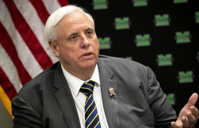 West Virginia Governor Jim Justice signed a law banning trans girls and women from participating in school sports consistent with their gender identity. Photo: Courtesy Reuters