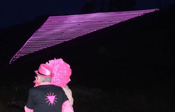 Pink Triangle co-founder Patrick Carney, left, and Sister Roma cheered as the 25th annual display of the pink triangle on Twin Peaks was lighted last year. Photo: Rick Gerharter