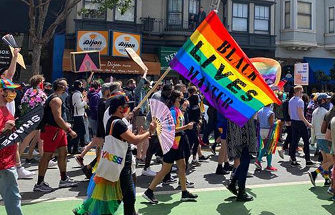 Hundreds of people took part in last year's People's March on Polk Street at California and Pine streets. Photo: John Ferrannini  