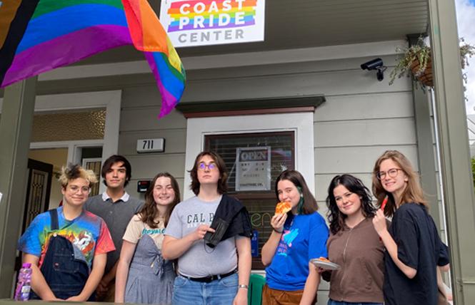 Local young adults who hang out at the CoastPride Community Center include, from left, Novak Chernesky, Joe Torrey, Emily Cooke, Corwin Jones, Jessie Hedger-Walter, Maggie Stack, Gwina Putz, and Bella Forth. Photo: CoastPride Center