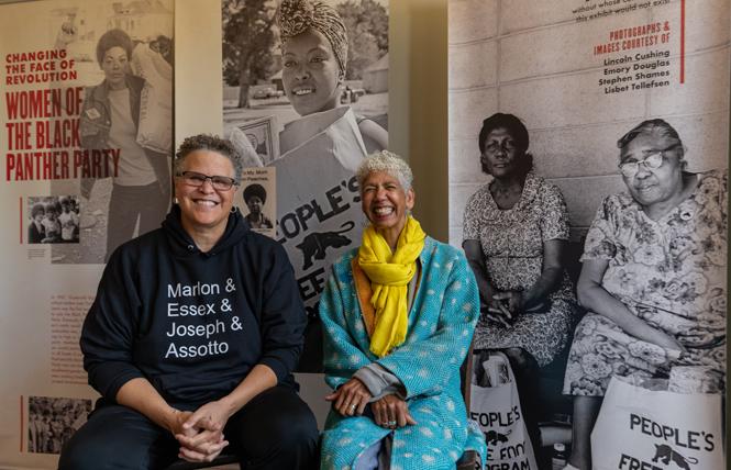 Archivist Lisbet Tellefsen, left, with her partner and former Black Panther party leader Ericka Huggins sit in front of the exhibit showcasing women in the Black Panther Party, housed in the home of Jilchristina "Jil" Vest at the corner of Center Street and Dr. Huey P. Newton Way in West Oakland. Photo: Jane Philomen Cleland