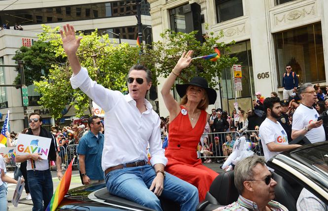 Governor Gavin Newsom and his wife, first partner Jennifer Siebel Newsom, rode in the 2019 San Francisco Pride parade — a first for a sitting governor. Photo: Rick Gerharter