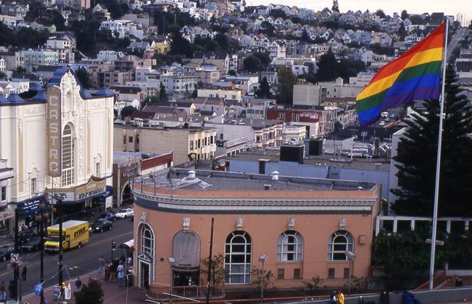 Gilbert Baker's rainbow flag installation flies above Castro and Market streets. Photo: Rick Gerharter