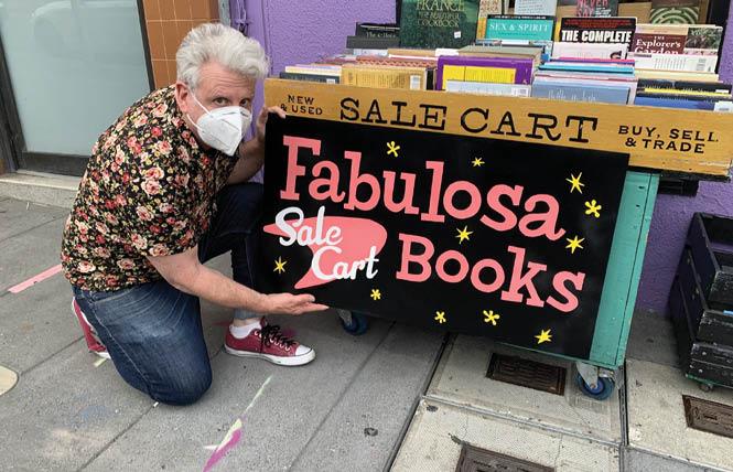 Alvin Orloff points to the new name he will christen Dog Eared Books in the Castro next month. Photo: Courtesy Alvin Orloff