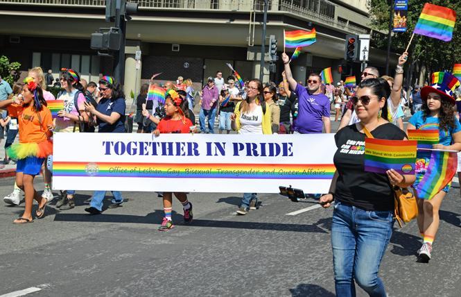 Maribel Martínez, right, director of the Santa Clara County Office of LGBTQ Affairs, marched with the office's contingent in the 2016 Silicon Valley Pride parade. Photo: Jo-Lynn Otto  