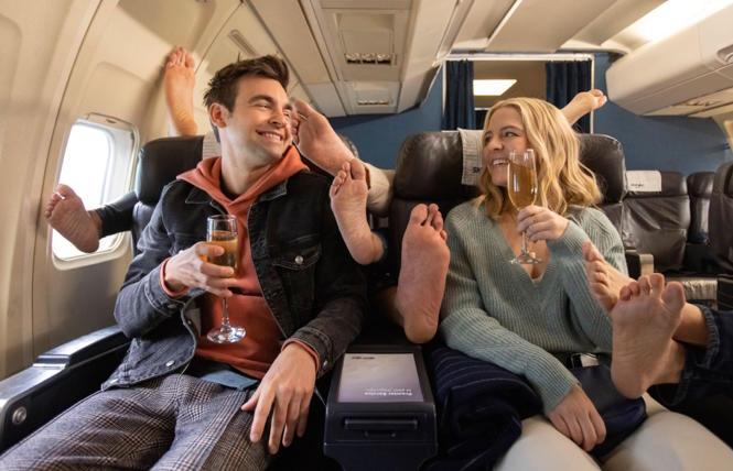 Cary (Drew Tarver) and Brooke (Heléne York) enjoy First Class feet in 'The Other Two.'
