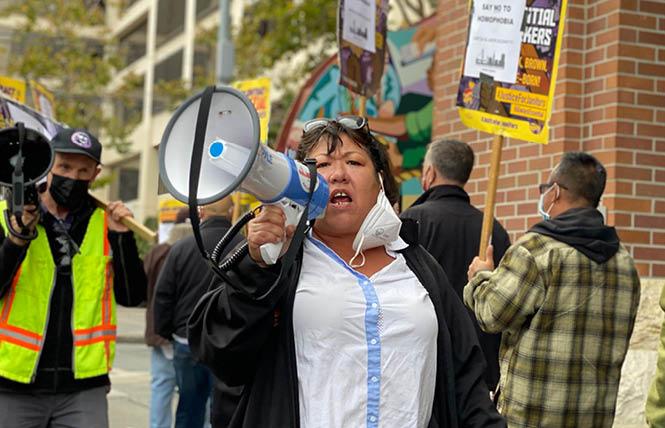 Kim Tavaglione, the interim executive director of the San Francisco Labor Council, leads a picket line outside of the waterfront Hotel Vitale October 7. Labor and LGBTQ activists, and a smattering of local pols, showed up to denounce a reportedly former contractor with the hotel's renovation project that was accused of homophobia. Photo: John Ferrannini