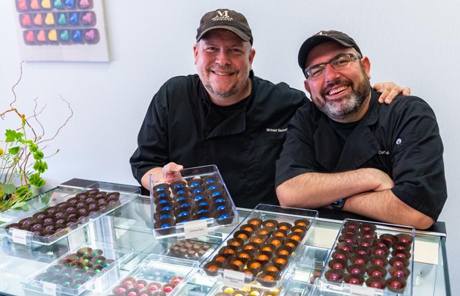 Chocolatier Michael Benner, left, was joined by his husband, Curtis Wallis, at the opening of Michael's Chocolates in Oakland October 2. Photo: Jane Philomen Cleland