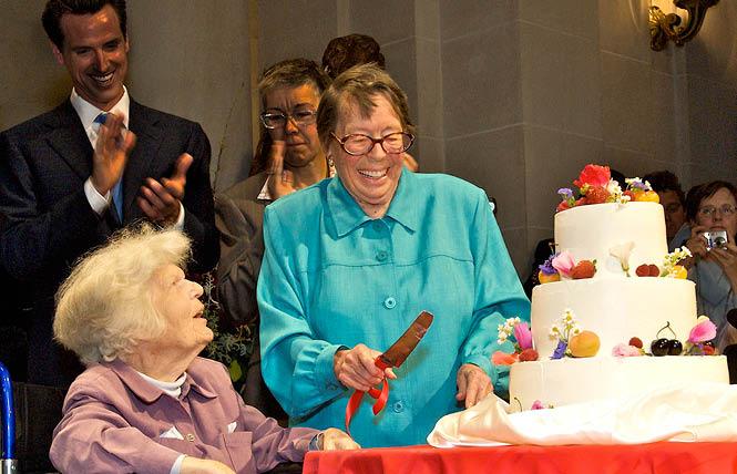 Phyllis Lyon, right, prepares to cut the wedding cake after she and Del Martin were married in San Francisco City Hall June 17, 2008. Photo: Jane Philomen Cleland