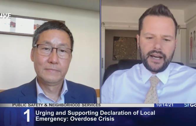 Supervisor Gordon Mar, left, listens as Supervisor Matt Haney talks about his resolution declaring a state of emergency in San Francisco on the drug overdose crisis. Photo: Screengrab