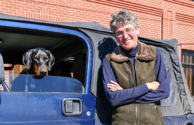 Oregon congressional candidate Jamie McLeod-Skinner stands next to her Jeep Wrangler with her dog, Moshi, in the driver's seat. Photo: Courtesy McLeod-Skinner campaign