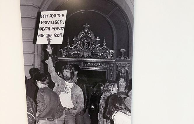 David Patrick Stucky, holding sign, was captured in Daniel Nicoletta's photo at the May 21, 1979 protest outside San Francisco City Hall shortly after the verdicts were announced in the trial of Dan White for killing supervisor Harvey Milk and mayor George Moscone. Photo: Matthew S. Bajko