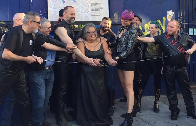 Rachele Sullivan, center, cut the ribbon outside the old Stud bar June 12, 2018 to celebrate the designation of San Francisco's Leather and LGBTQ Cultural District. Photo: Liz Highleyman 
