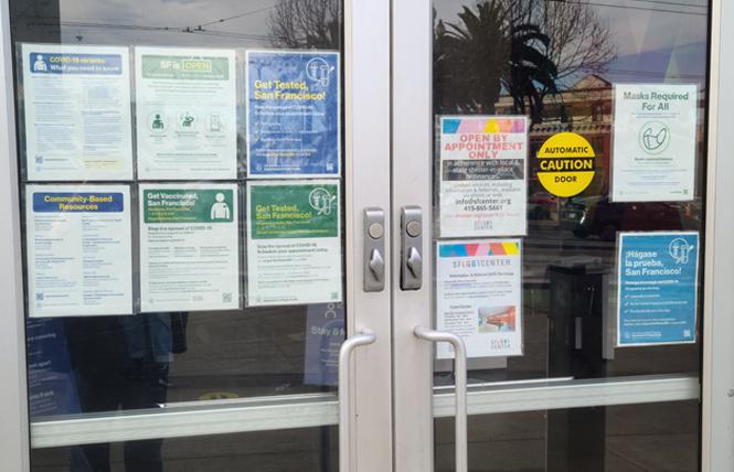 Signs posted on the door of San Francisco's LGBT Community Center last week indicated that masks are required inside; most places in California ended indoor mask mandates February 16. Photo: Cynthia Laird<br><br>