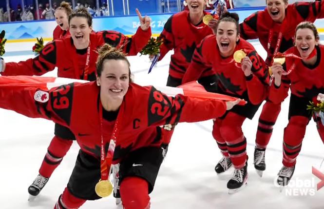Canada's women's ice hockey team celebrates with their gold medals.