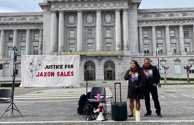 Angie Aquino-Sales, left, and her husband, Jim Sales, speak at a vigil in San Francisco Civic Center February 26 for their son Jaxon, who died nearly two years ago. Photo: Adam Echelman