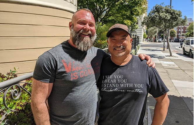 James Juanillo, right, and his friend James Gosnell stood on the sidewalk where Juanillo hosted a chalk art protest in Pacific Heights June 9. Photo: Eric Burkett
