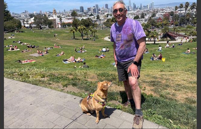 Martin Alperen, 65, is struggling to navigate his mental health medication with his new Medicare plan. He walks at least five miles a day with his dog, Marley. One of his favorite destinations is Mission Dolores Park. Photo: Adam Echelman