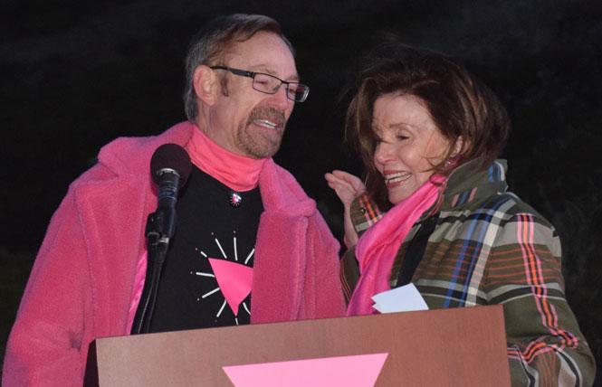 Pink triangle co-founder Patrick Carney, left, was joined at this year's lighting of the pink triangle by House Speaker Nancy Pelosi (D-San Francisco). Photo: Bill Wilson