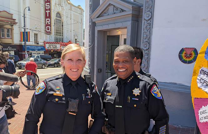 San Francisco Police Officer Kathryn Winters, left, and police Chief William Scott held a news conference at Harvey Milk Plaza to talk about safety measures this Pride weekend. Photo: Eric Burkett