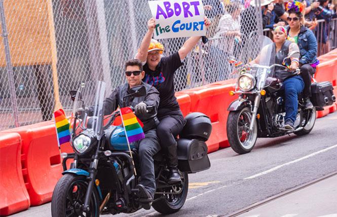 Members of the Dykes on Bikes contingent express their anger at the U.S. Supreme Court decision reversing the right to abortion in the June 26 San Francisco Pride parade. Photo: Jane Philomen Cleland<br>