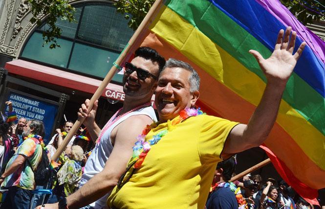 San Francisco Supervisor Matt Dorsey, shown riding in the June 26 Pride parade, has tested positive for COVID and is isolating at home. Photo: Rick Gerharter