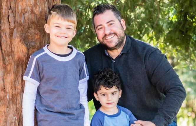Oakland school board candidate Nick Resnick stands with his sons Jude, left, and Dylan. Photo: Courtesy Nick Resnick<br>