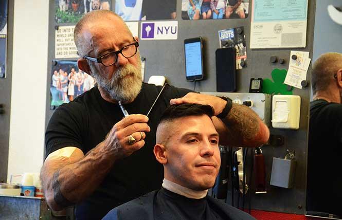 Joe Gallagher, owner of Joe's Barbershop, cuts the hair of longtime customer Nik Medrano. Photo: Rick Gerharter