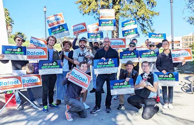 Supervisor Rafael Mandelman, center, gathered with Prop L supporters at a rally for the transportation measure. Photo: Courtesy Yes on L campaign