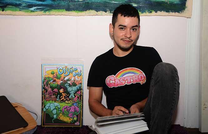 Dimas Jose Arellano, creator of Castro Boy, works in his sketchbook on ideas for his Castro Boy images that are reproduced in stickers, a T-shirt, and a small poster. He is developing a game that includes a set of playing cards. Photo: Rick Gerharter