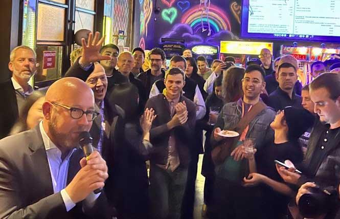 Supervisor Rafael Mandelman, left, addresses supporters at his election night party in the Castro. Photo: Courtesy Twitter