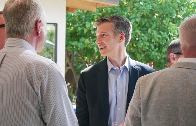 Gay U.S. House candidate Will Rollins, center, is currently in second place in his bid to oust from office conservative Riverside County Republican Congressmember Ken Calvert. Photo: Courtesy Twitter.